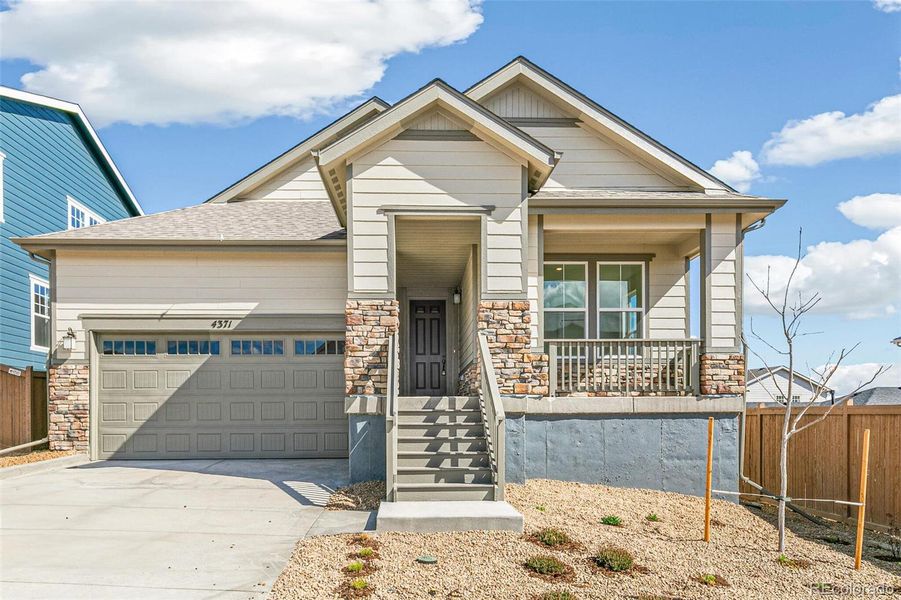 Front exterior of a new home in Terrain Oak Valley, Castle Rock, CO, highlighting curb appeal (Image 1).
