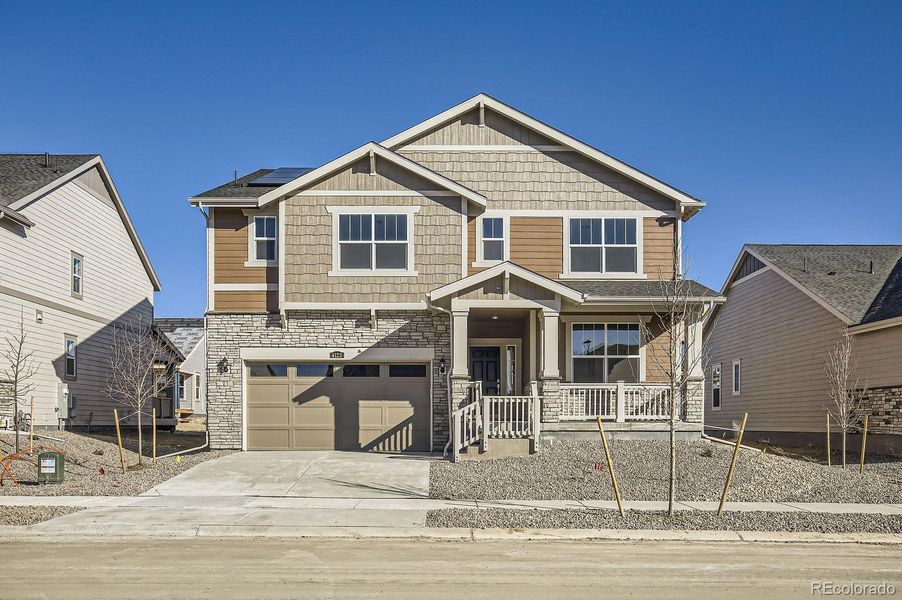 Front exterior of a new home in Ledge Rock: The Monarch Collection, Johnstown, CO, highlighting curb appeal (Image 12). Front exterior of a new home in Ledge Rock: The Monarch Collection, Johnstown, CO, highlighting curb appeal (Image 12).