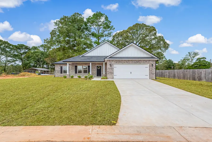 Front exterior of a new home in Barton's Bend, Crestview, FL, highlighting curb appeal (Image 1). Front exterior of a new home in Barton's Bend, Crestview, FL, highlighting curb appeal (Image 1).