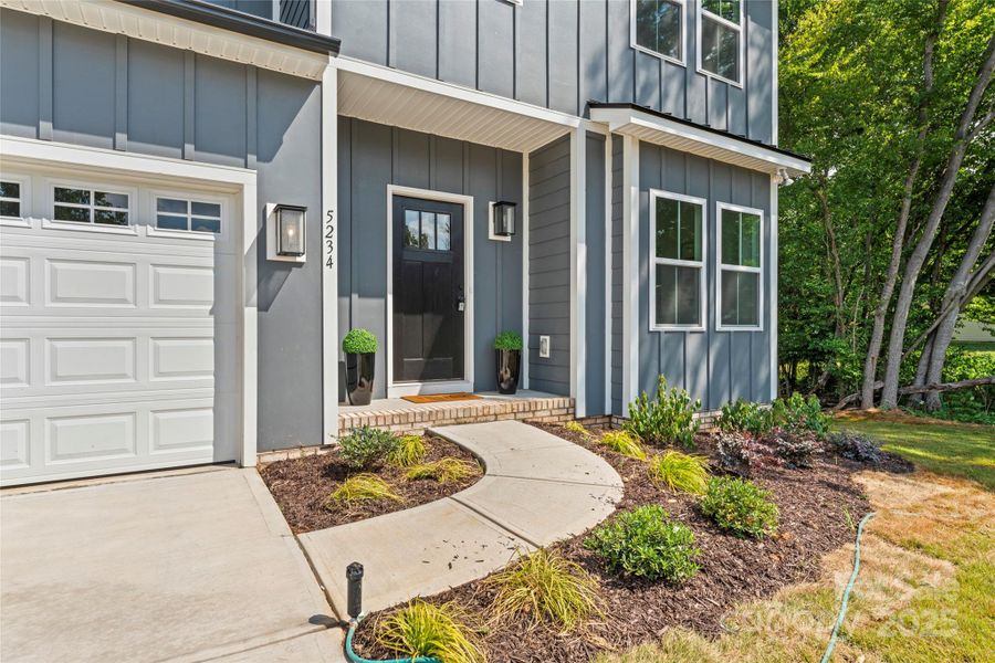 Front exterior of a new home in , Harrisburg, NC, highlighting curb appeal (Image 23).