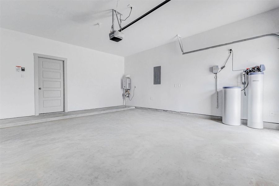 pacious, clean, and well-organized, this 2-car garage includes a tankless water heater and water softener system for modern efficiency. Whether you're parking, storing, or setting up a workshop, you'll appreciate the durable concrete floor, high ceilings, and smart layout that makes room for all your tools, bikes, and weekend projects with ease. pacious, clean, and well-organized, this 2-car garage includes a tankless water heater and water softener system for modern efficiency. Whether you're parking, storing, or setting up a workshop, you'll appreciate the durable concrete floor, high ceilings, and smart layout that makes room for all your tools, bikes, and weekend projects with ease.