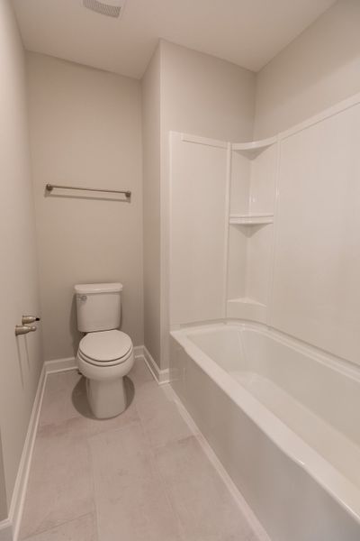 Representative furnished interior of a home built from the Dalton by Parkside Builders in The Woods, Gallatin (Image 10).