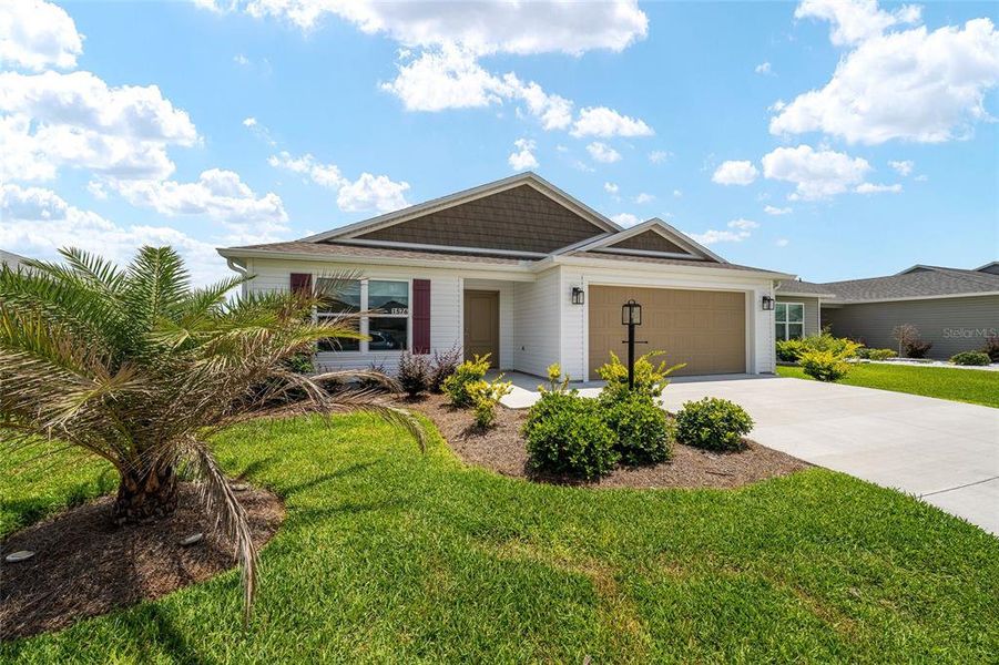 Front exterior of a new home in , The Villages, FL, highlighting curb appeal (Image 20).