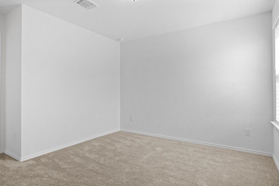 Unfurnished room featuring carpet flooring and baseboards