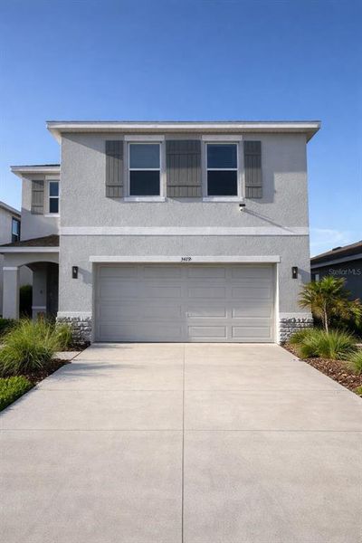 Front exterior of a new home in Star Farms at Lakewood Ranch, Bradenton, FL, highlighting curb appeal (Image 1). Front exterior of a new home in Star Farms at Lakewood Ranch, Bradenton, FL, highlighting curb appeal (Image 1).