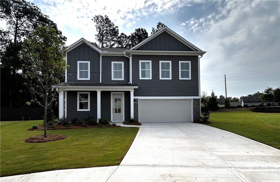 Front exterior of a new home in Maddox Landing, Hoschton, GA, highlighting curb appeal (Image 1).