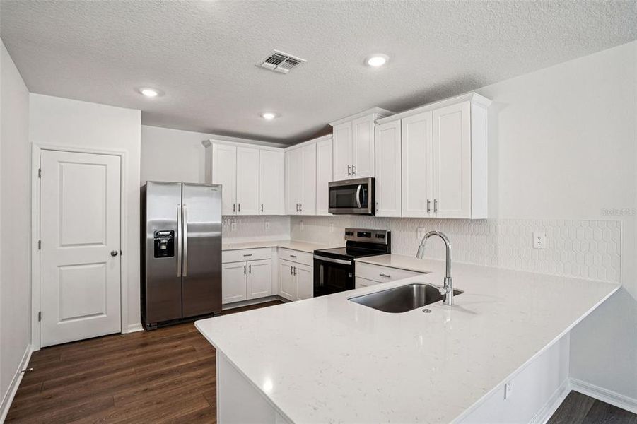 Furnished interior view inside a new home in Ridgehaven - Villas, Ormond Beach (Image 11).