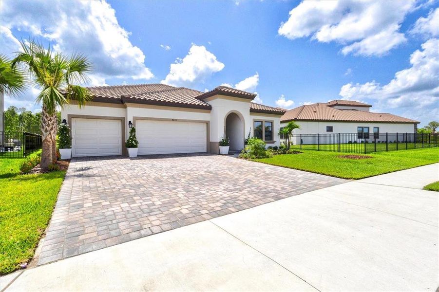 Front exterior of a new home in Crosswind Ranch, Parrish, FL, highlighting curb appeal (Image 32).