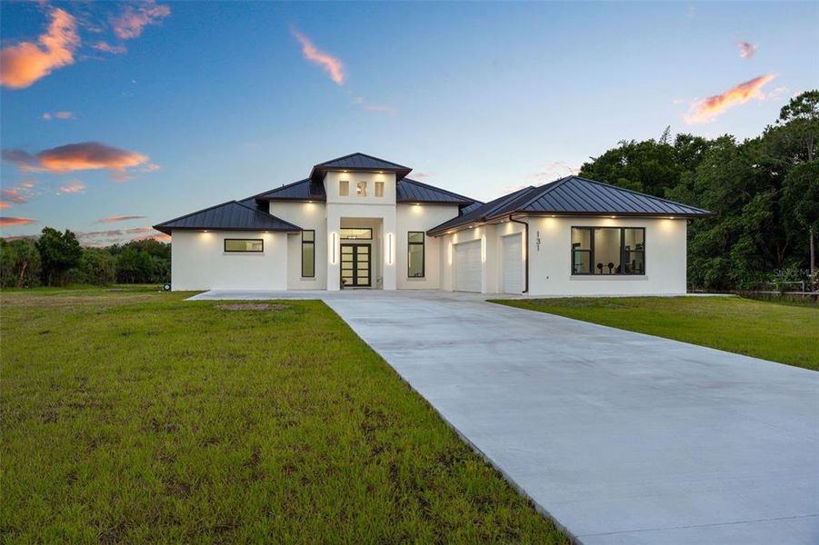 Front exterior of a new home in , Palm Bay, FL, highlighting curb appeal (Image 24). Front exterior of a new home in , Palm Bay, FL, highlighting curb appeal (Image 24).