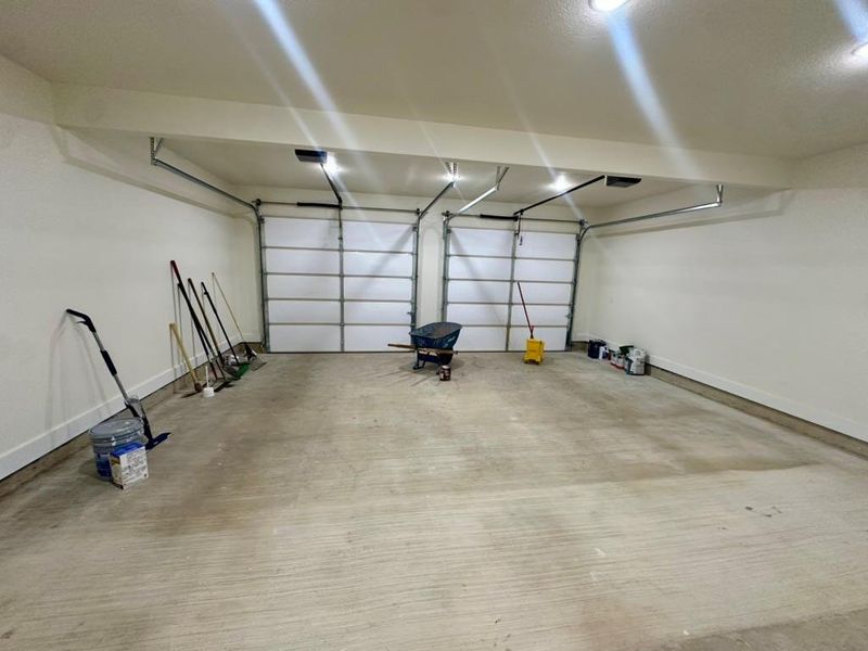 Garage featuring baseboards