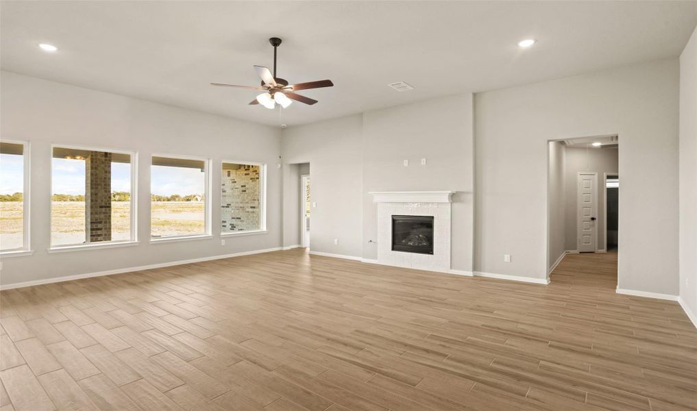 Impressive great room with cozy fireplace (*Photo not of actual home and used for illustration purposes only.) Impressive great room with cozy fireplace (*Photo not of actual home and used for illustration purposes only.)