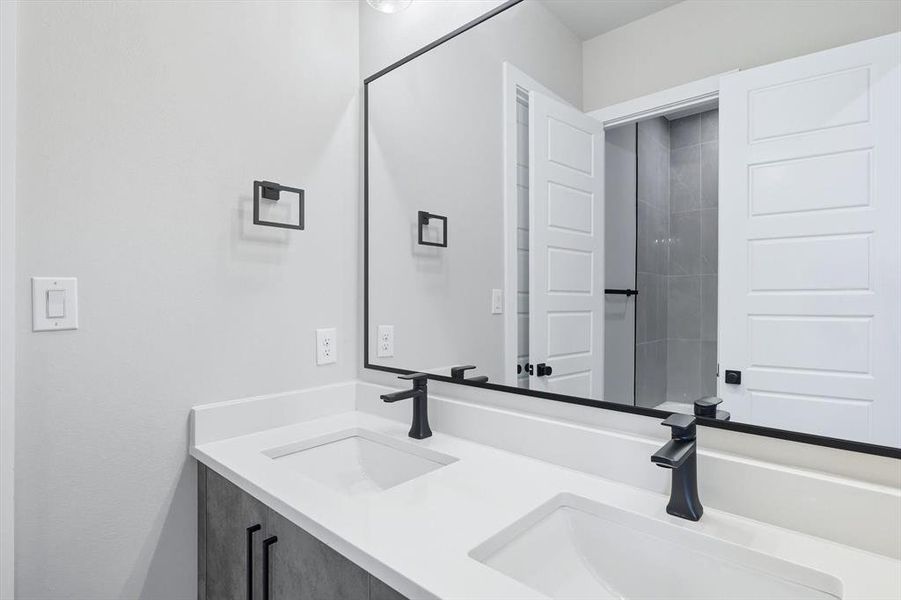 Bathroom featuring double vanity Bathroom featuring double vanity
