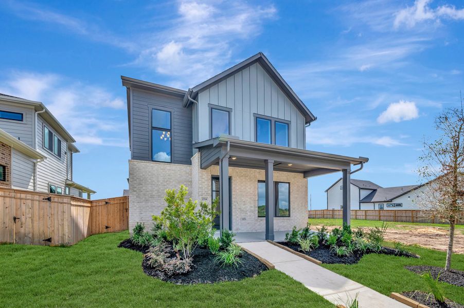 Front exterior of a new home in Sienna - Landmark Row Collection, Missouri City, TX, highlighting curb appeal (Image 23). Front exterior of a new home in Sienna - Landmark Row Collection, Missouri City, TX, highlighting curb appeal (Image 23).