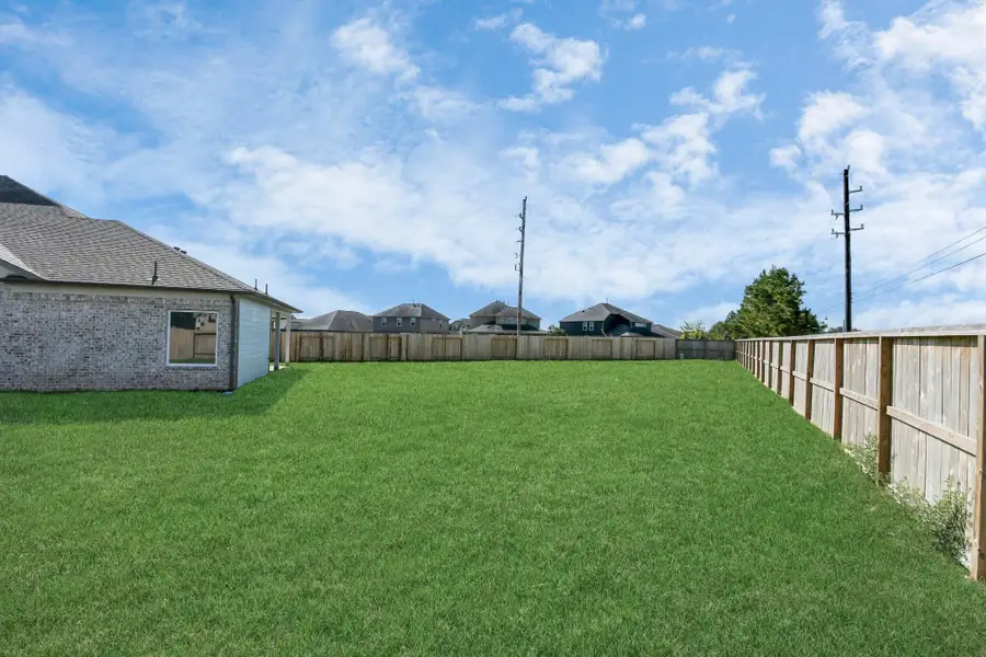 Backyard retreat, offering an abundance of space for kids to play and explore. The possibilities are endless in this outdoor haven, where the joy of open-air activities and family gatherings awaits. Backyard retreat, offering an abundance of space for kids to play and explore. The possibilities are endless in this outdoor haven, where the joy of open-air activities and family gatherings awaits.