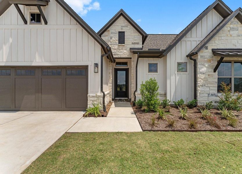 Front exterior of a new home in , Fulshear, TX, highlighting curb appeal (Image 21). Front exterior of a new home in , Fulshear, TX, highlighting curb appeal (Image 21).