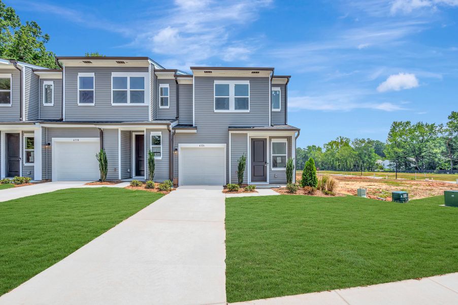Front exterior of a new home in Amplitude, Charlotte, NC, highlighting curb appeal (Image 2). Front exterior of a new home in Amplitude, Charlotte, NC, highlighting curb appeal (Image 2).