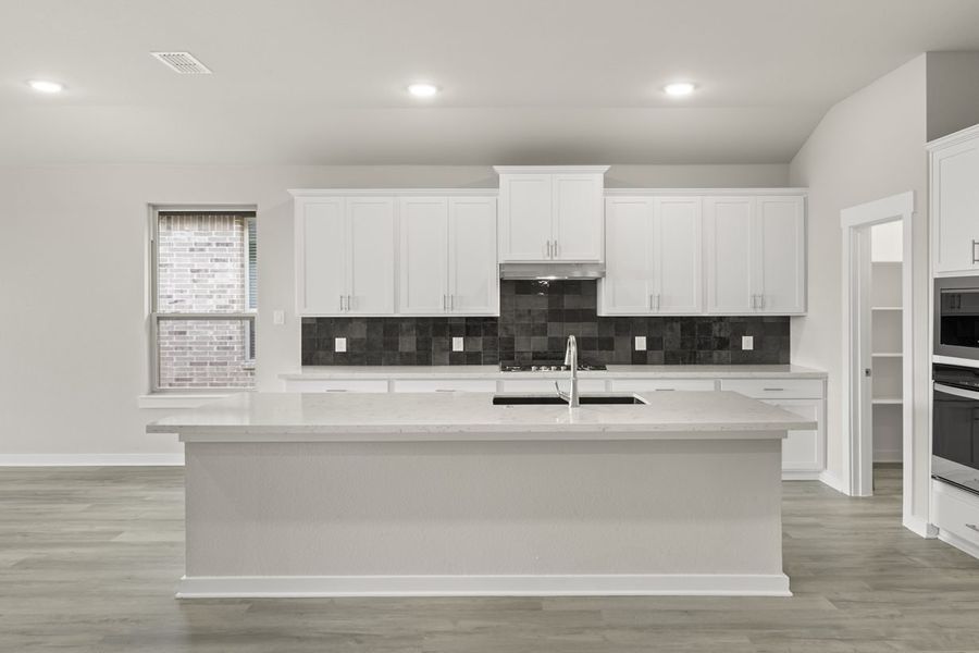 Representative furnished interior of a home built from the Hickory Sunterra 50s by Brohn Homes in Sunterra, Katy (Image 4).