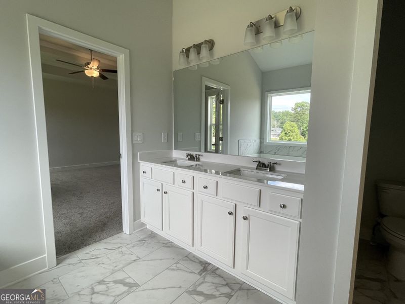 Furnished interior view inside a new home in Enclave at Logan Point, Loganville (Image 8).