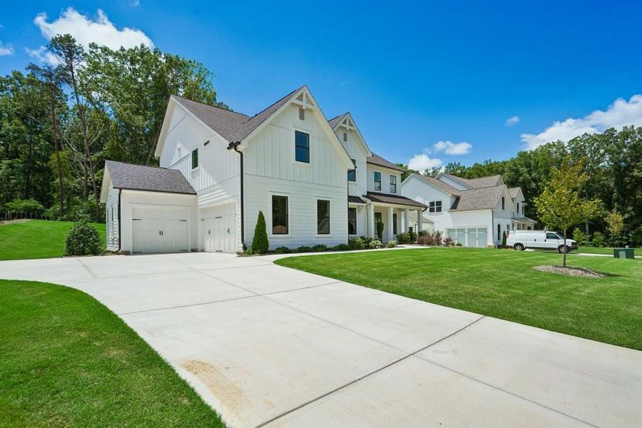 Front exterior of a new home in Arden on Lanier, Cumming, GA, highlighting curb appeal (Image 25).