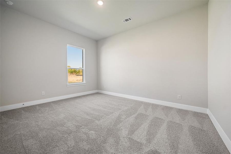 Empty room with carpet floors and recessed lighting Empty room with carpet floors and recessed lighting