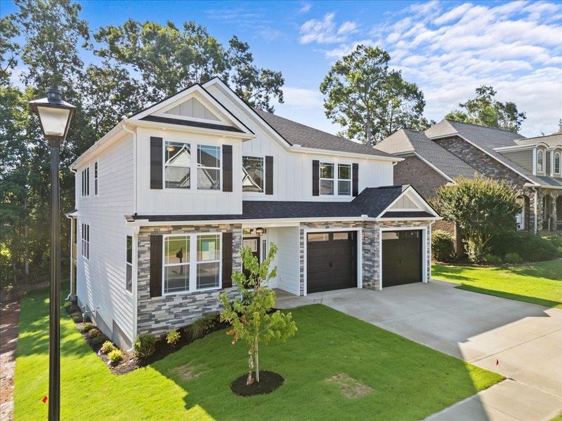 Front exterior of a new home in Lakeside at Blue Ridge Plantation, Taylors, SC, highlighting curb appeal (Image 2).