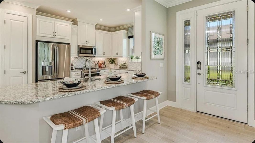 Furnished interior view inside a new home in Esplanade at Azario Lakewood Ranch, Bradenton (Image 9). Furnished interior view inside a new home in Esplanade at Azario Lakewood Ranch, Bradenton (Image 9).