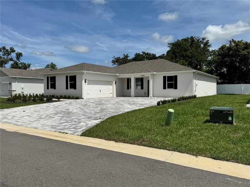 Front exterior of a new home in , Dade City, FL, highlighting curb appeal (Image 29).
