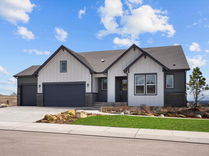 Front exterior of a new home in Jackson Creek, Monument, CO, highlighting curb appeal (Image 30).