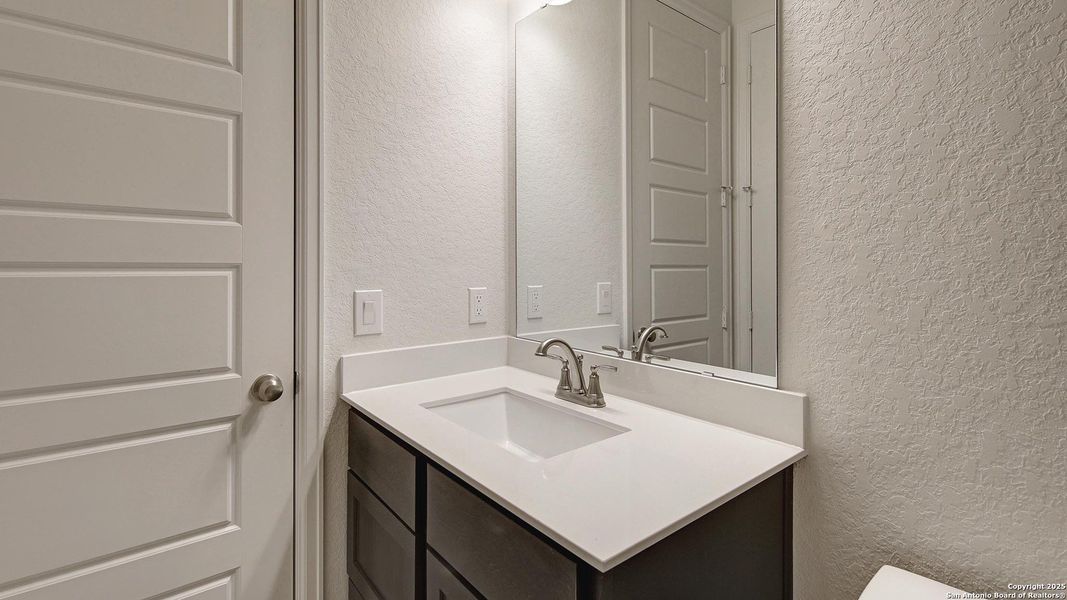 Furnished interior view inside a new home in Stevens Ranch 55', San Antonio (Image 10).