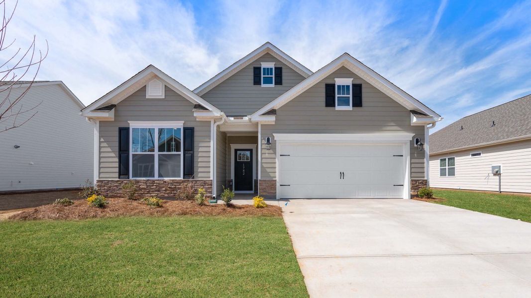 Front exterior of a new home in Reserve at Tap Root Farms, Fletcher, NC, highlighting curb appeal (Image 1). Front exterior of a new home in Reserve at Tap Root Farms, Fletcher, NC, highlighting curb appeal (Image 1).