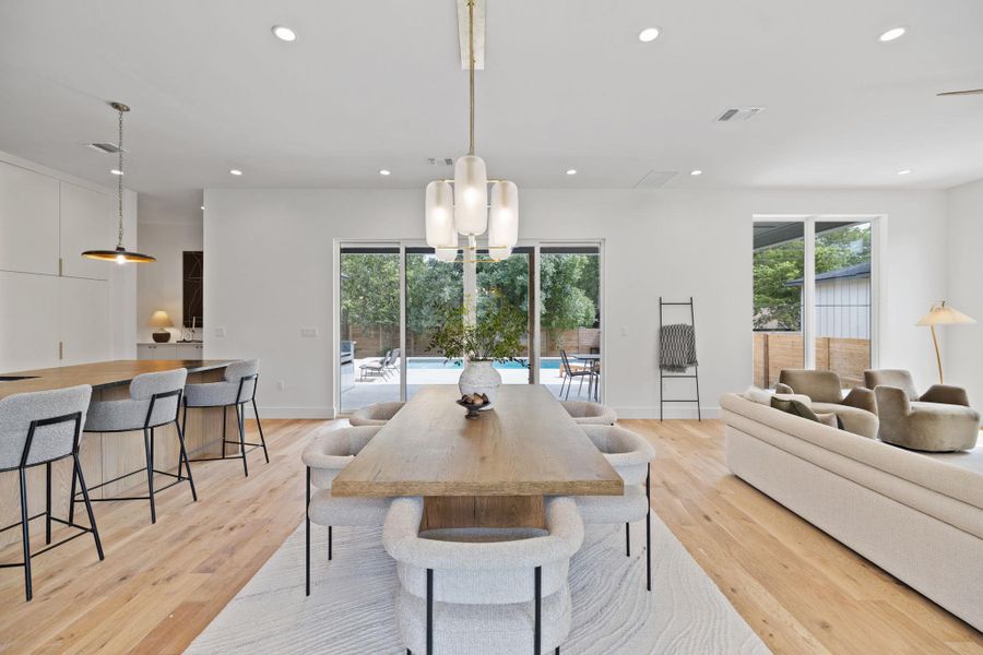 Dining space featuring plenty of natural light, recessed lighting, and light wood-style floors Dining space featuring plenty of natural light, recessed lighting, and light wood-style floors