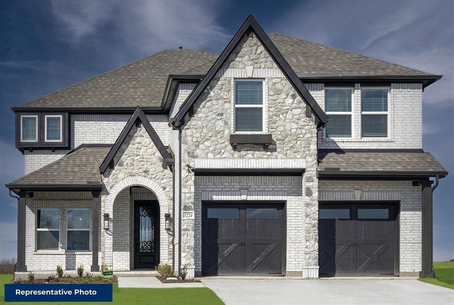 Front exterior of a new home in Inspiration, Seis Lagos, TX, highlighting curb appeal (Image 21).