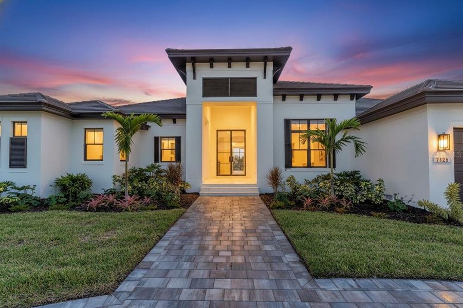 Front exterior of a new home in , Sarasota, FL, highlighting curb appeal (Image 26).
