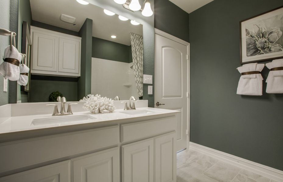 Secondary baths with dual sinks perfect for guests