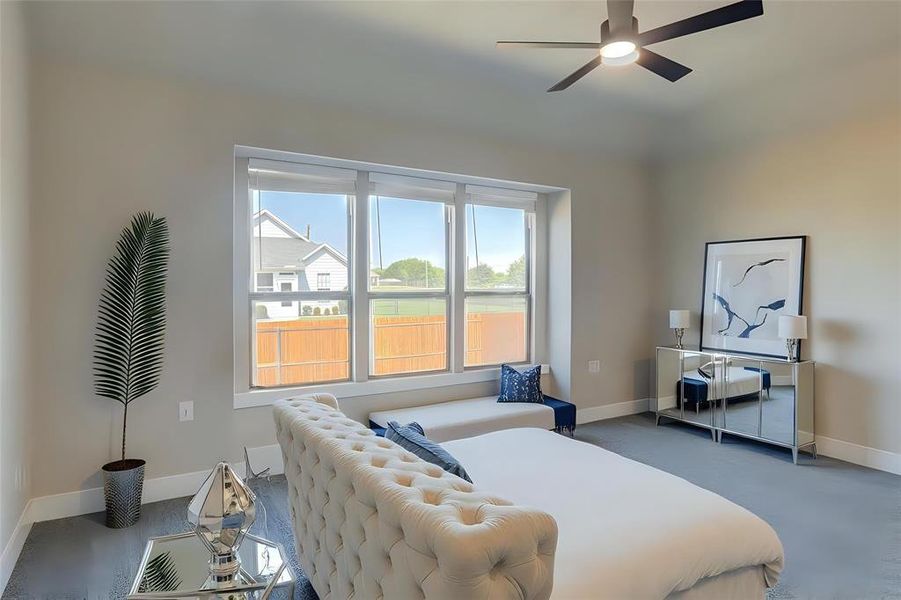 Bedroom with baseboards and ceiling fan Bedroom with baseboards and ceiling fan