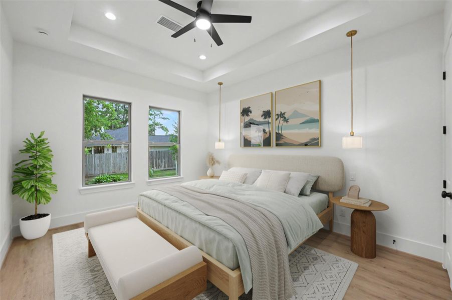 Primary bedroom w/tray ceiling & pendant reading lamps. Virtually staged.