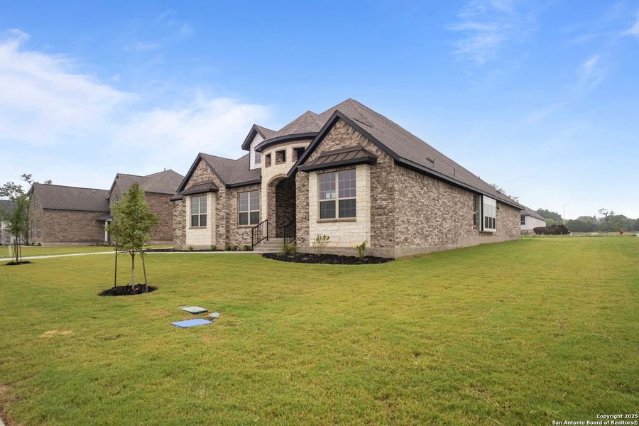Front exterior of a new home in Potranco Oaks, Castroville, TX, highlighting curb appeal (Image 36).