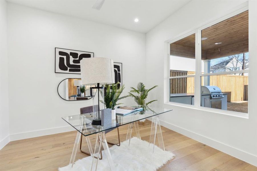 Home office featuring hardwood / wood-style floors