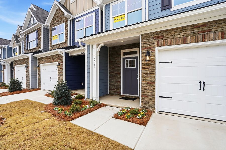 Exterior details and patio area of a home in Harrisburg Village Townhomes, Harrisburg (Image 3).