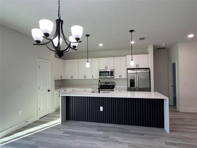Furnished interior view inside a new home in , Dunnellon (Image 4).