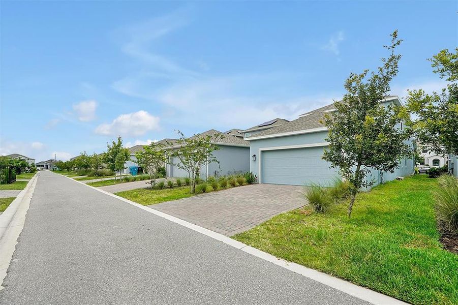 Front exterior of a new home in , Orlando, FL, highlighting curb appeal (Image 2).