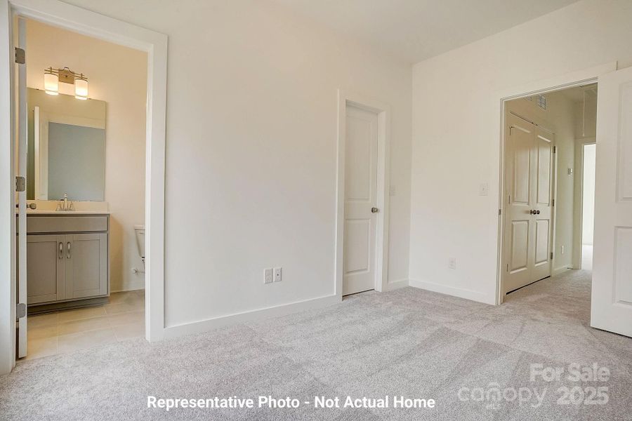 Bedroom 2 with full bath and walk-in closet-Cambridge Plan