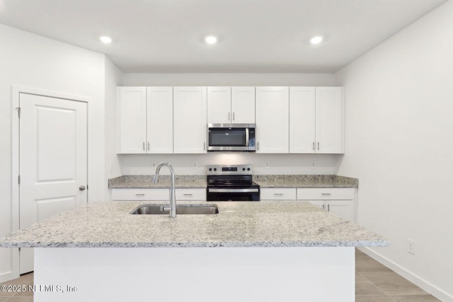 Furnished interior view inside a new home in Lakes at Bella Lago - Signature Series, Green Cove Springs (Image 8). Furnished interior view inside a new home in Lakes at Bella Lago - Signature Series, Green Cove Springs (Image 8).