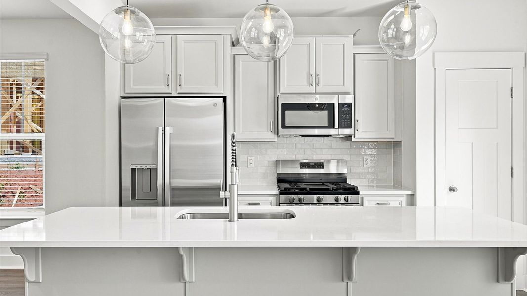Beautifully appointed kitchen with spacious counters and sophisticated detailing in Fountain Inn, SC Beautifully appointed kitchen with spacious counters and sophisticated detailing in Fountain Inn, SC