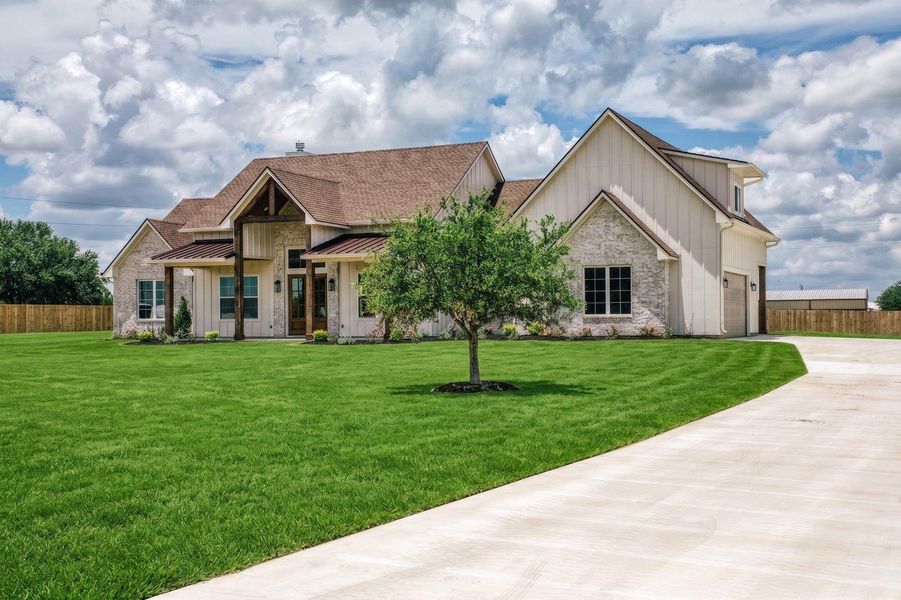 Front exterior of a new home in , Chappell Hill, TX, highlighting curb appeal (Image 1). Front exterior of a new home in , Chappell Hill, TX, highlighting curb appeal (Image 1).