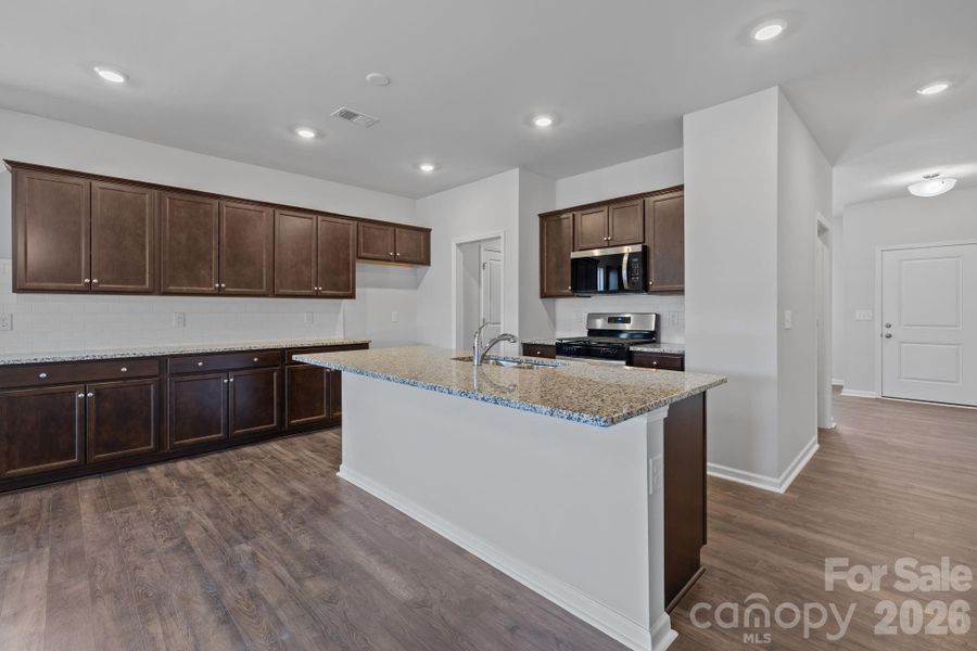 Furnished interior view inside a new home in McFarland Estates, York (Image 6).