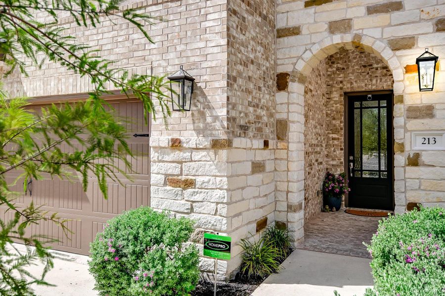 Exterior details and patio area of a home in Parmer Ranch, Georgetown (Image 23).