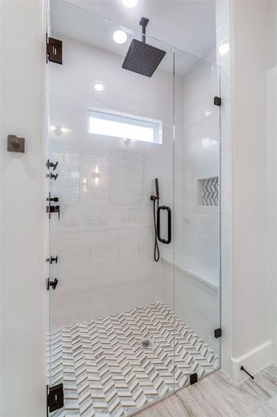 Bathroom with a shower with shower door