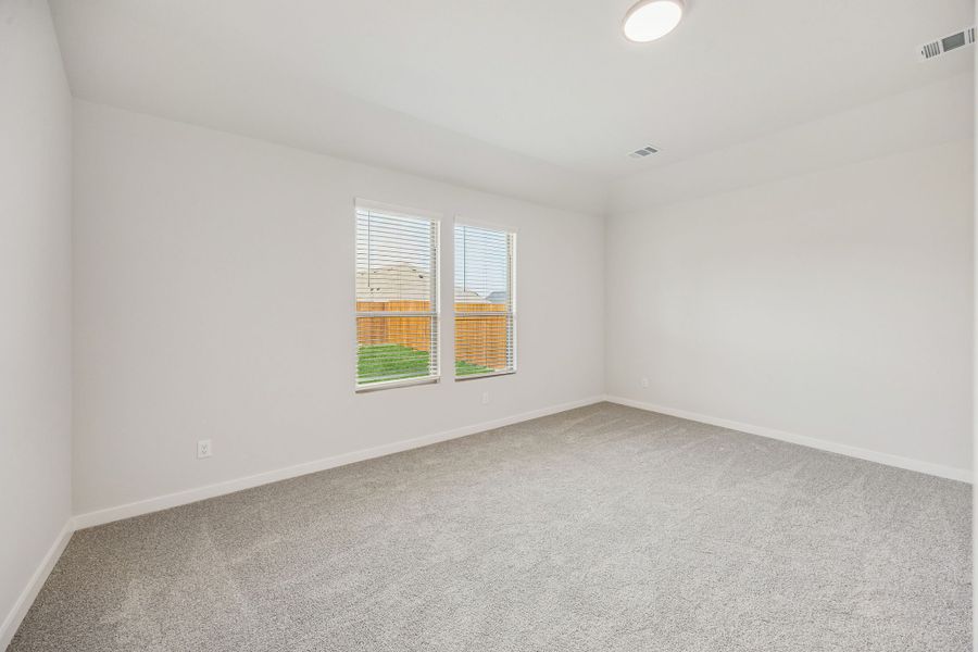 Primary Suite in the Stanley II home plan by Trophy Signature Homes – REPRESENTATIVE PHOTO