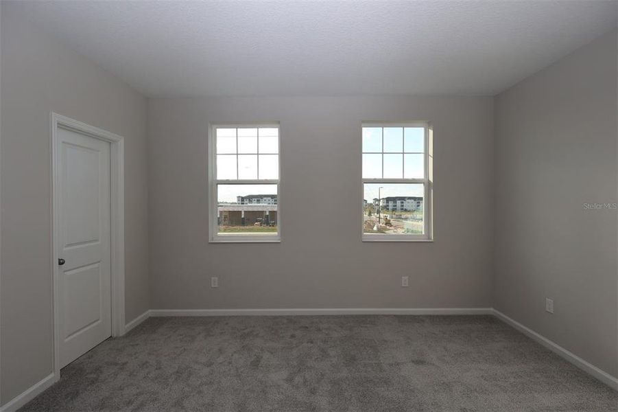 Spacious, unfurnished interior of a new home in Tribute at Ovation, Winter Garden (Image 18).